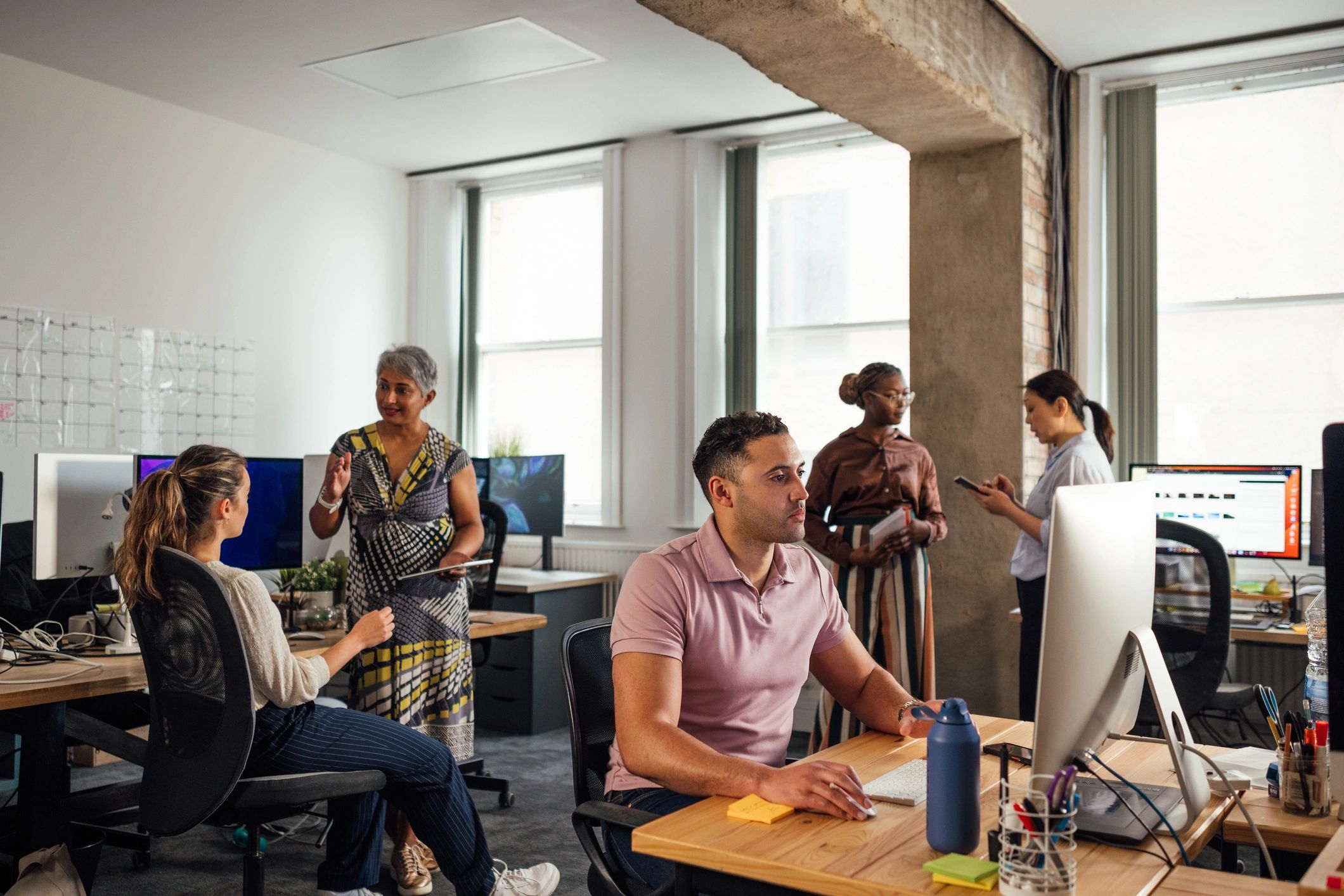 Digital marketing team collaborating in office